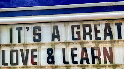 Sign reads “it’s a great love &learn”