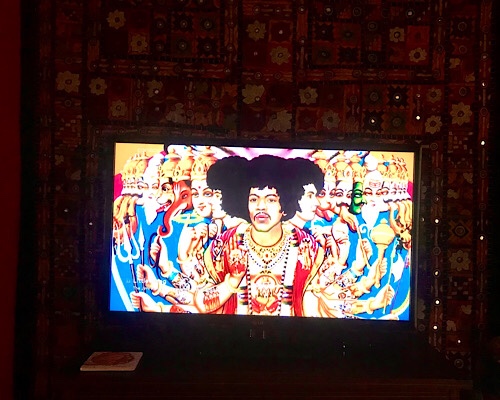 Partial image of album cover for Jimi Hendrix’s Little Wing with a colored drawing of Jimi Hendrix as a multi-headed and multi-armed deity 