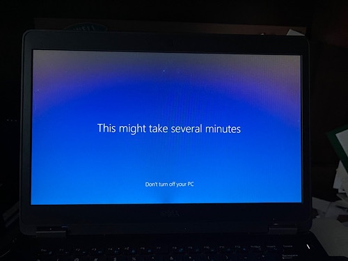 Image of computer with blue screen that says “this may take several minutes .”