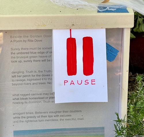 Sign says “pause”