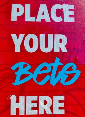 Photo of sign that reads “place your bets here.”