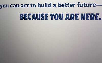 Sign on wall at Capitol Jewish Museum reads:  “you can act to build a better future—BECAUSE YOU ARE HERE.”