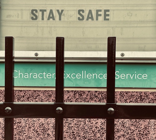 Sign that says “Stay Safe” and underneath, “Character Excellence Service”
