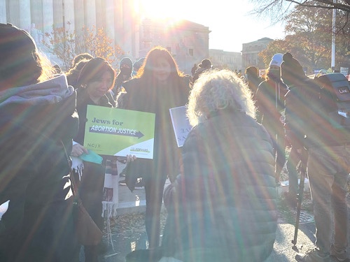 Photo of demonstrators in front of the United States Supreme Court showing a sign that reads, “Jews for Abortion Justice”